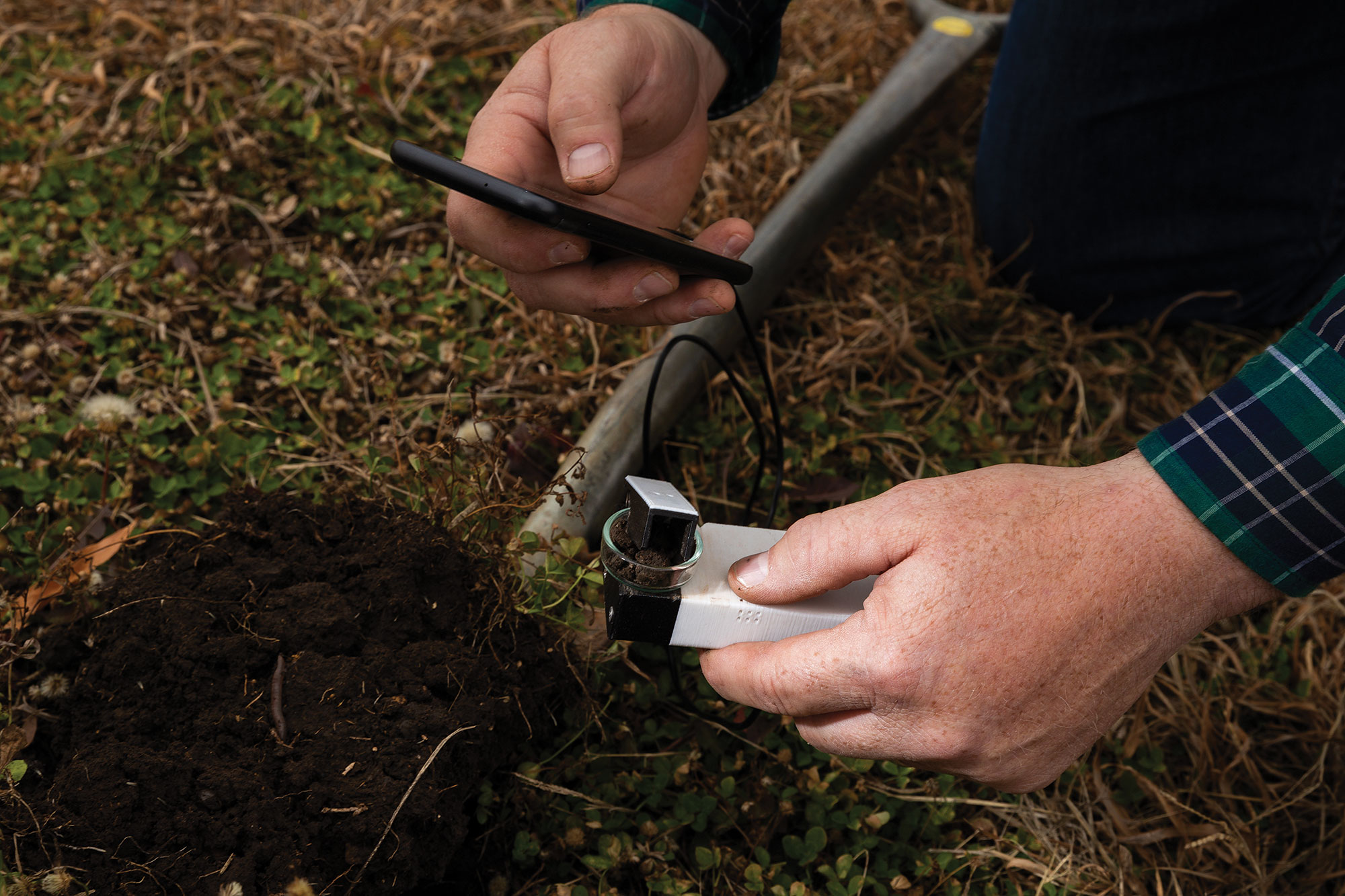 Inspecting soil with a sensor connected to a smart phone