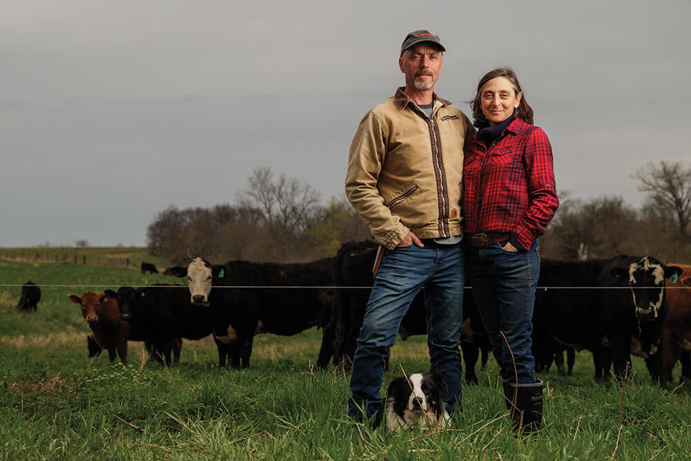 Beth Hoffman and John Hogeland with their dog and cattle