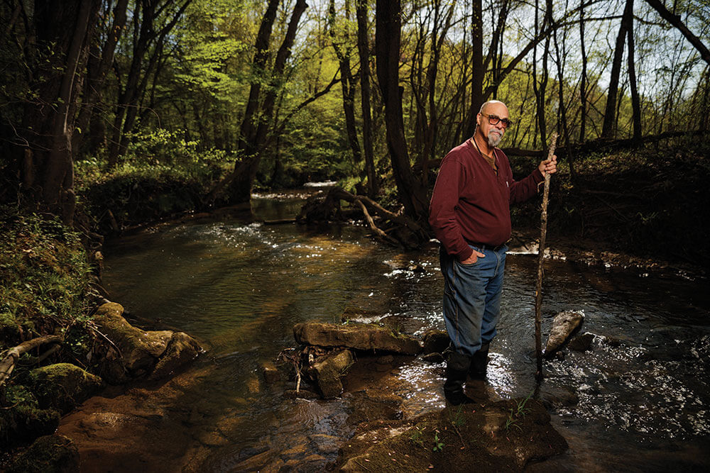 Mike Jones stands in beaver creek
