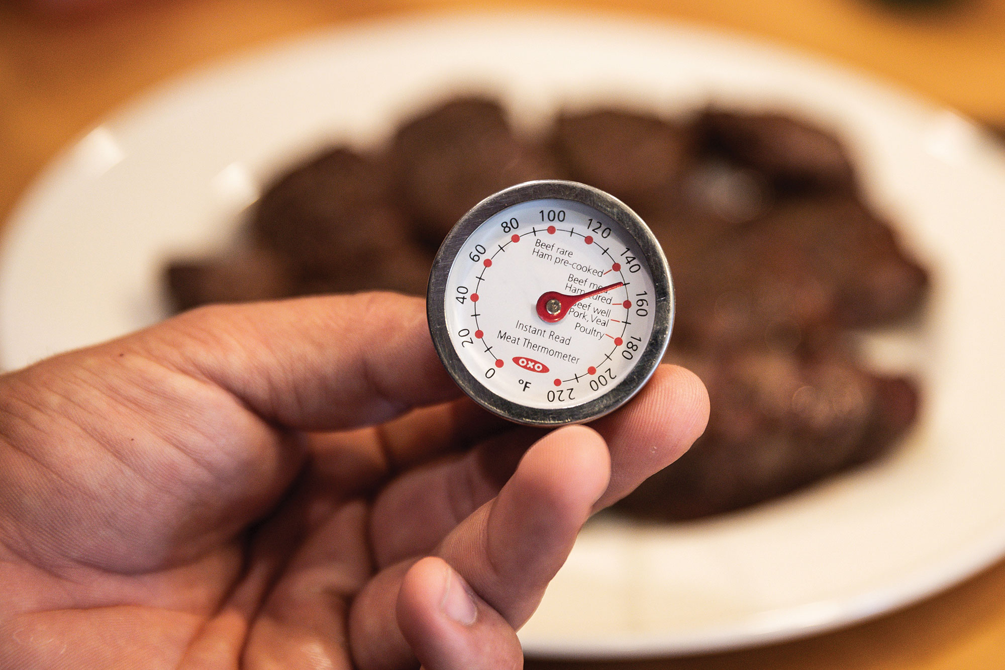 Checking temperature on meat