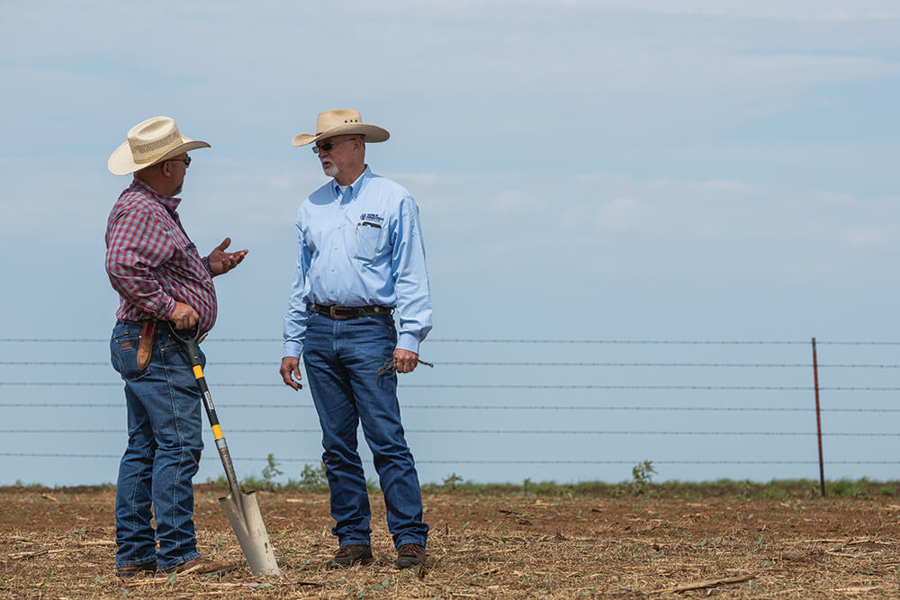 Hugh Aljoe talks with Jimmy Emmons on his ranch