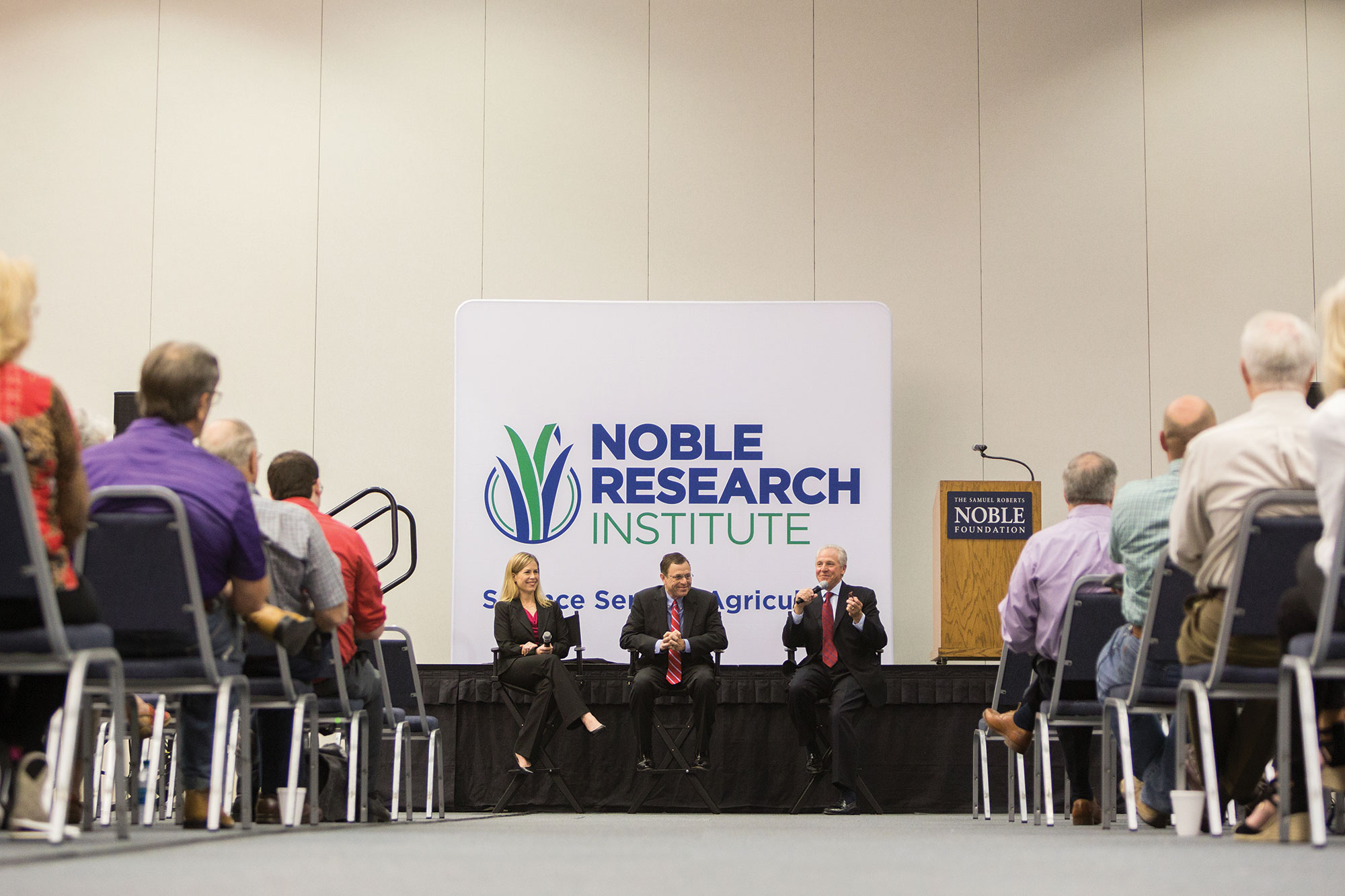 Steve Rhines (center) answers questions alongside former President Bill Buckner and former Director of Philanthropy, Engagement and Project Management Mary Kate Wilson during the Ardmore community announcement that the Noble Foundation would become known as the Noble Research Institute. 