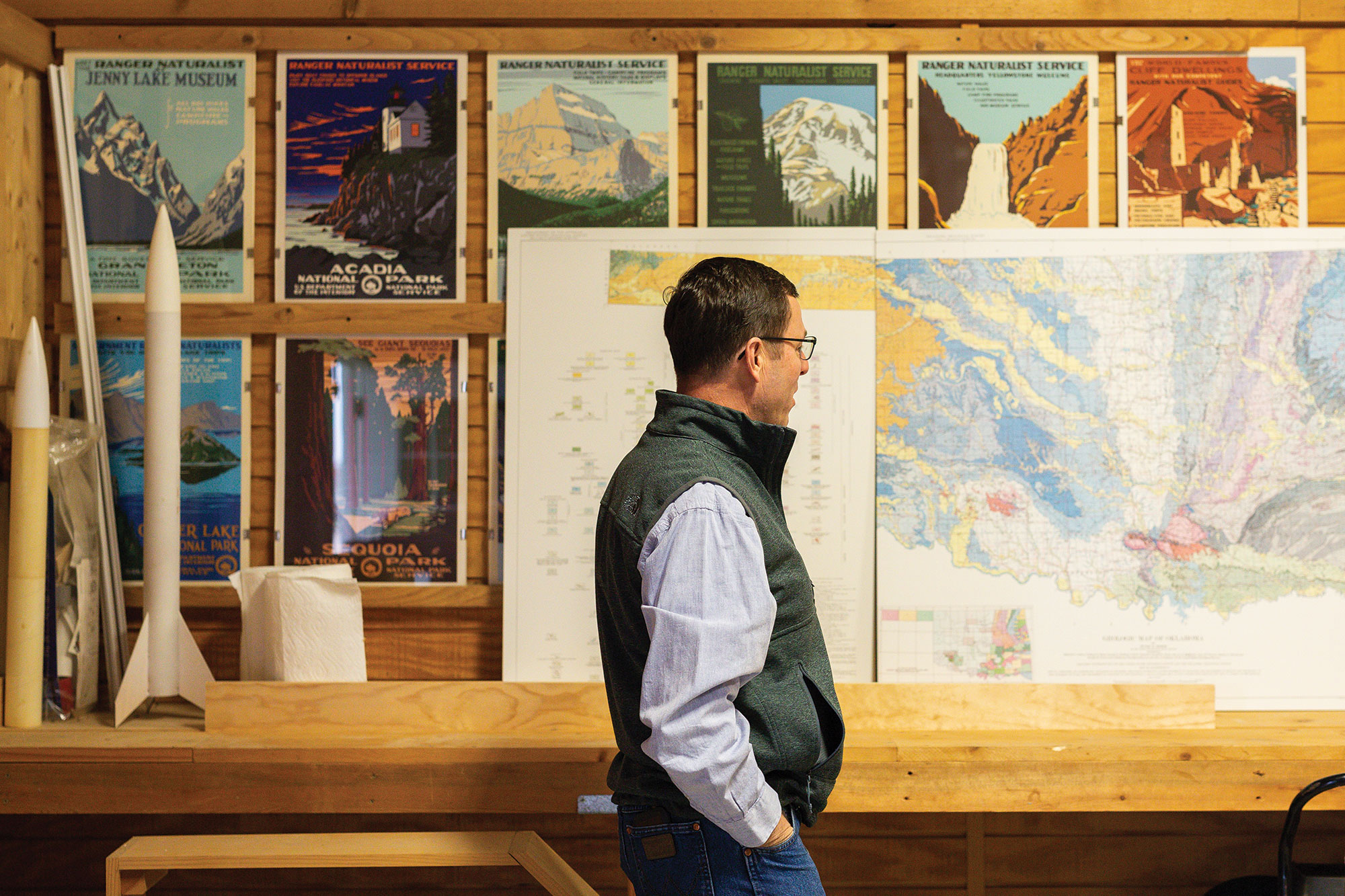 Steve Rhines keeps a map of Oklahoma soils, alongside model rockets, in his home workshop.