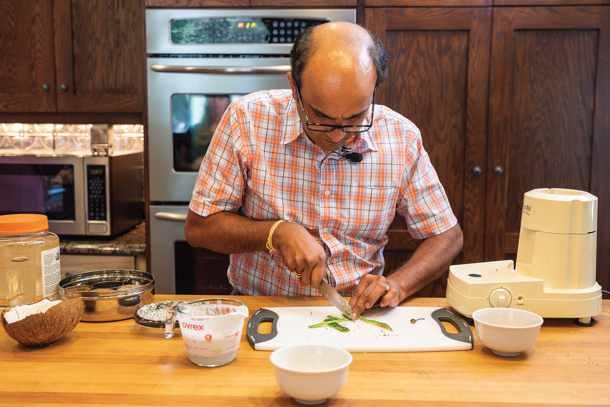 Suresh Bhamidimarri, Ph.D. chops serrano peppers