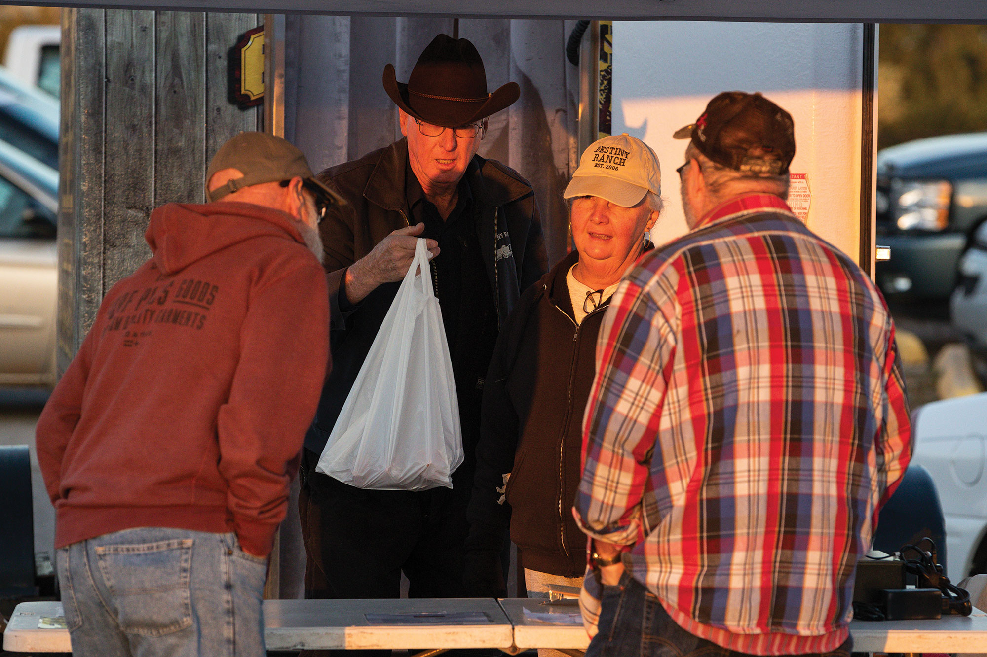 The Paynes (center) sell a portion of the beef they raise directly to consumers at the Cleveland County Farmers Market in Norman, Oklahoma.