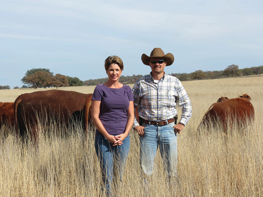 Rhona and Chad Lemke in their cattle pasture
