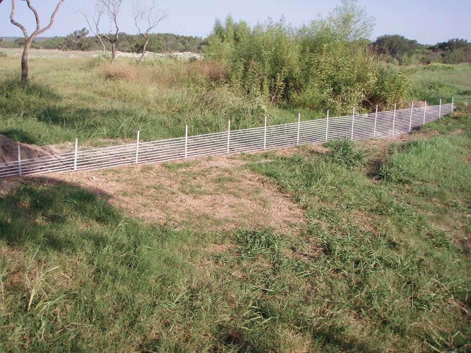 Figure 1. Figure 1. Panel-type parallel-bar barriers for earthen, rock and concrete spillways