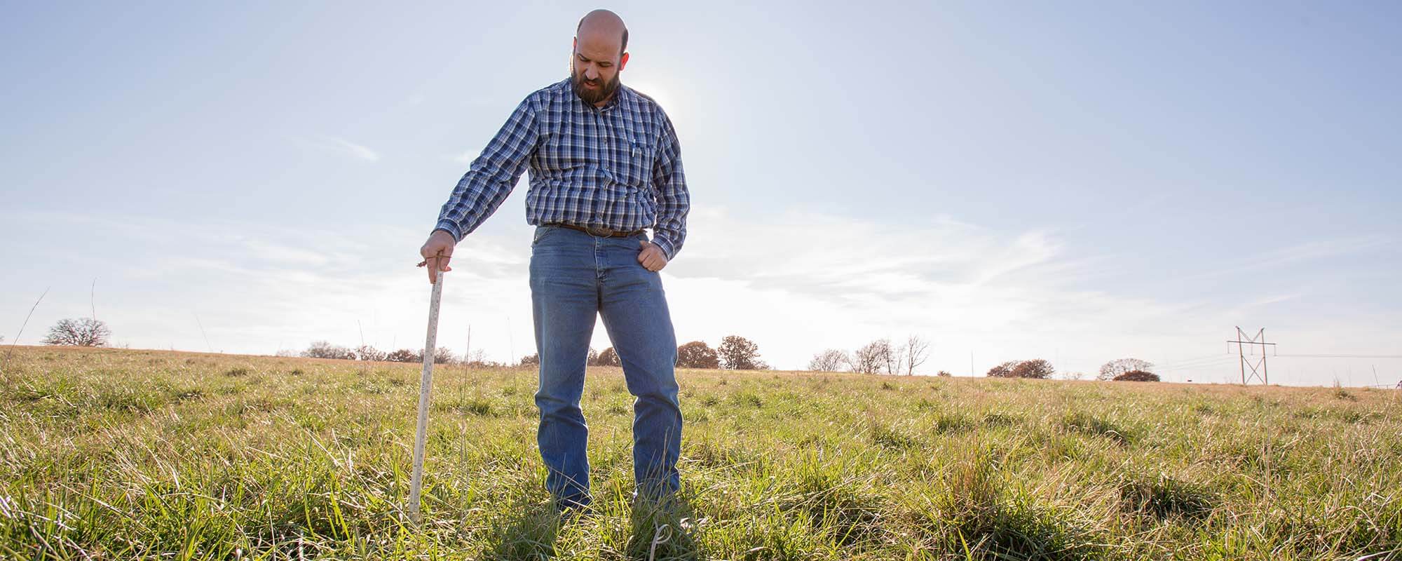 Rancher measures grass