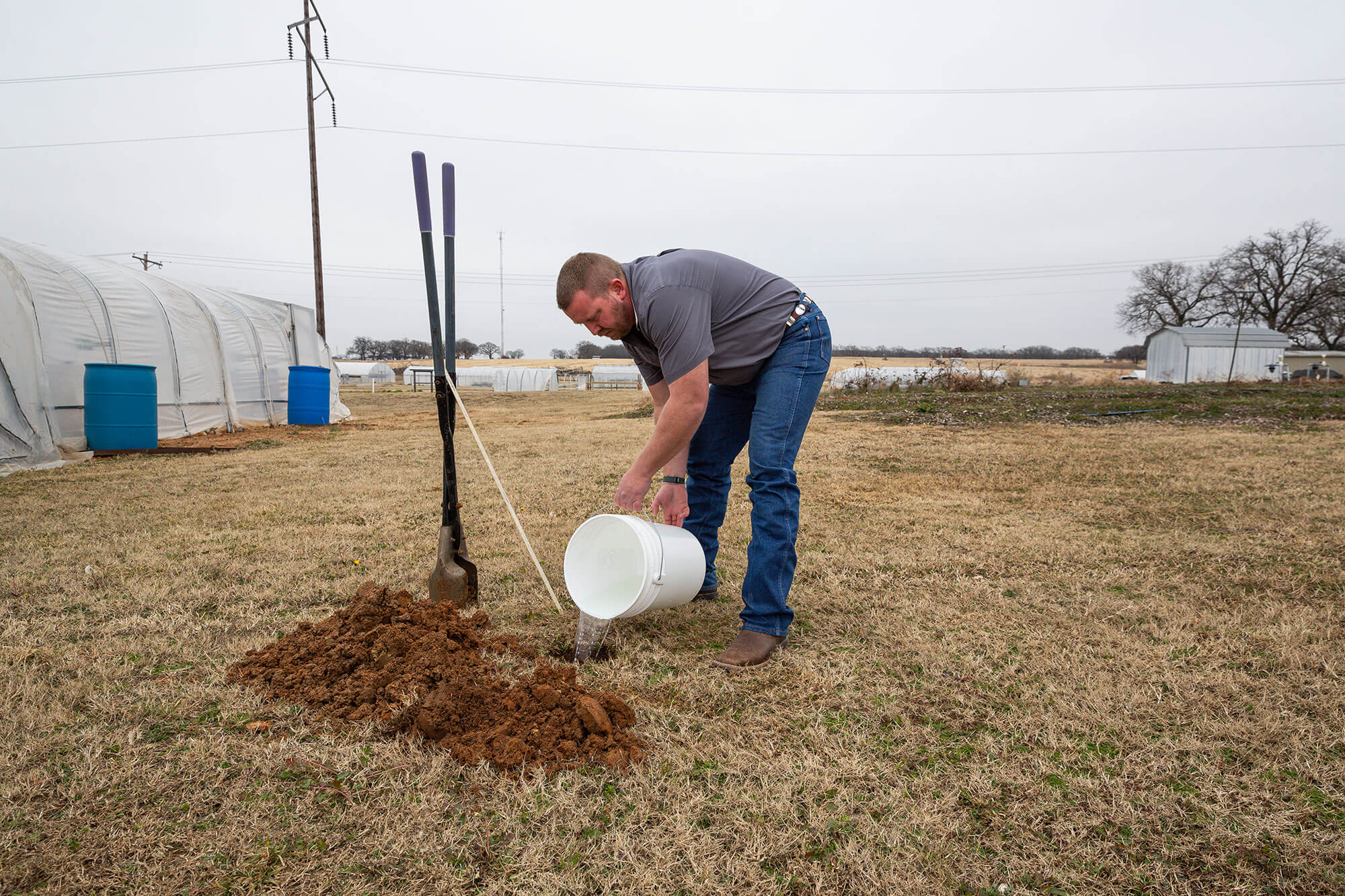 Will Chaney conducts a perc soil test
