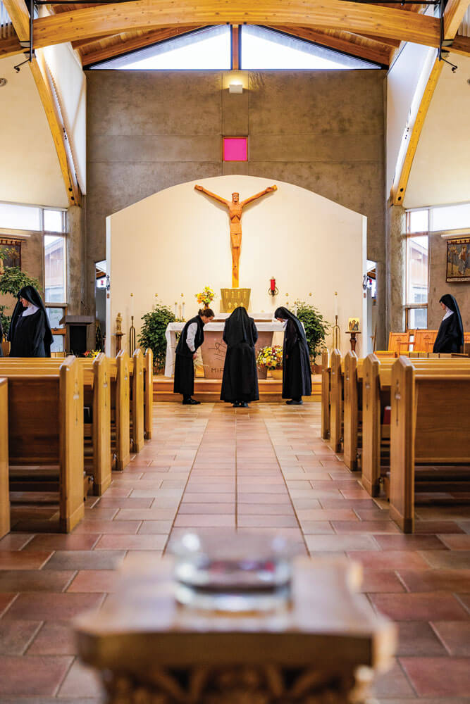 Nuns gather in sanctuary for vespers.