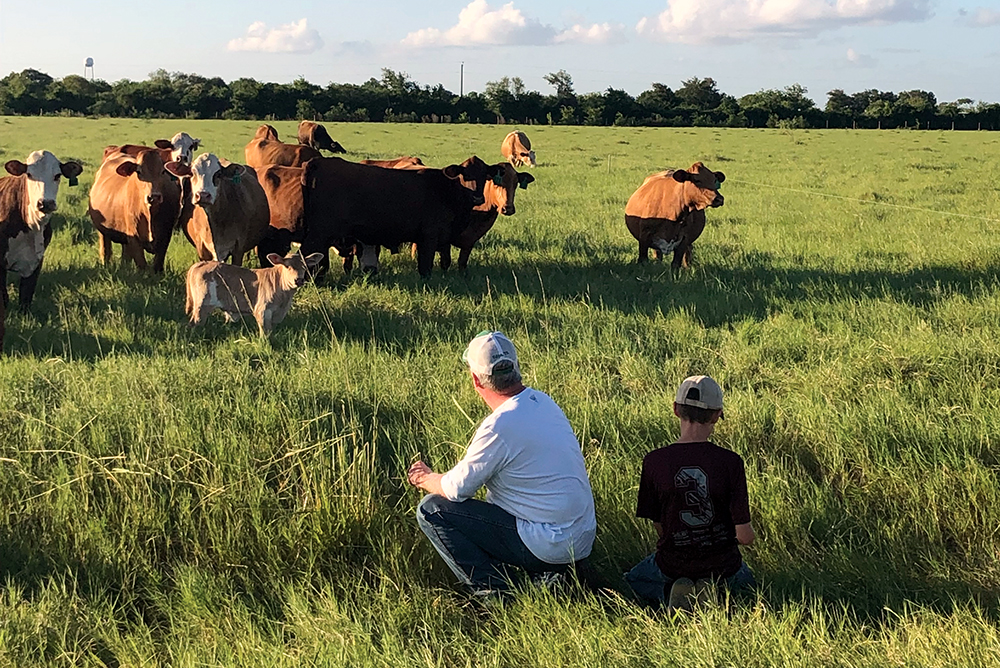 vance mitchell and grandson in pasture