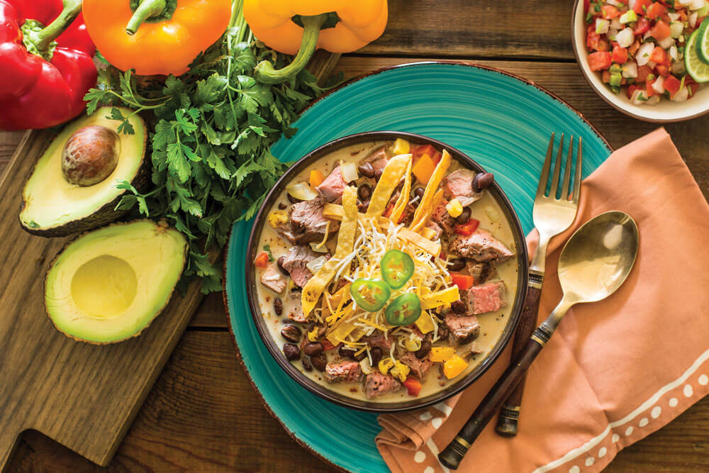 Finished beef fajita soup with toppings