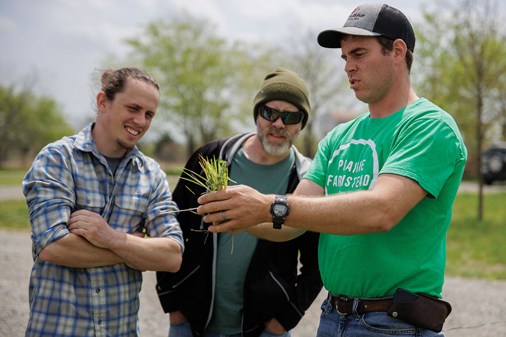 Chuck Trowbridge shows forage to Garrett Nickols and Brad Hammett from Heritage Butchery and BBQ