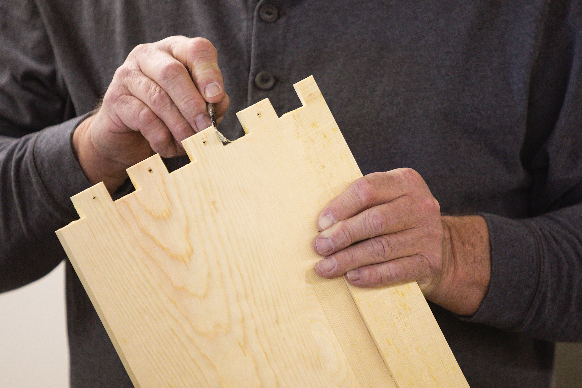 Applying wood glue to the corner joints.