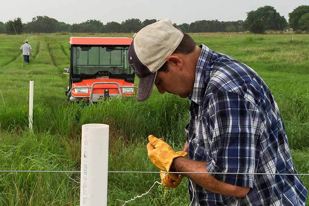 Fence conditions Rancher working on fence