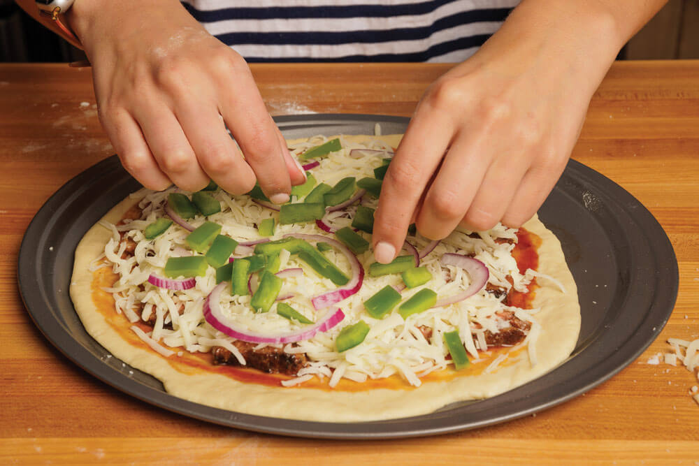 preparing the pizza
