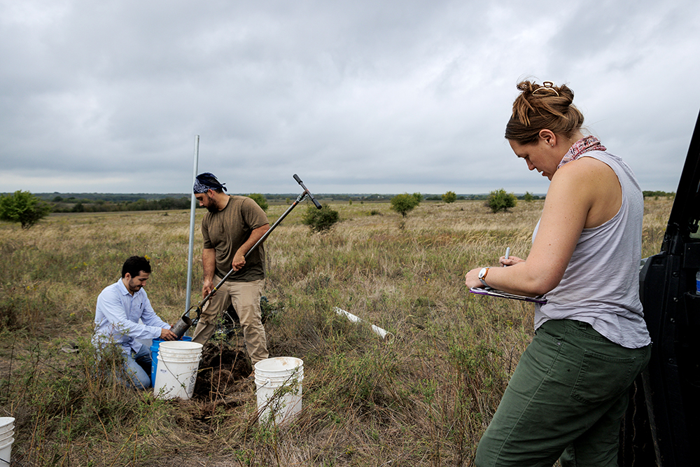 gathering soil samples in field