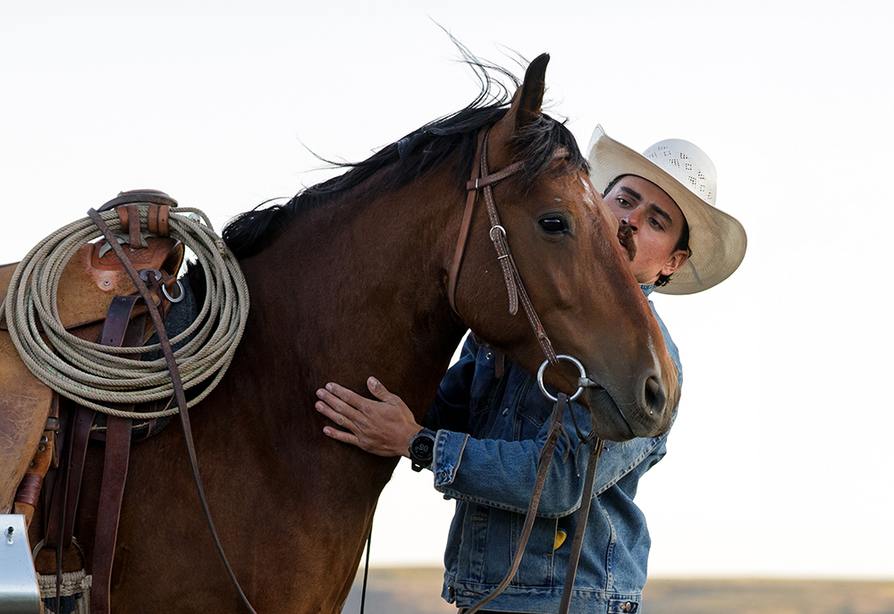 ranch intern with bronc